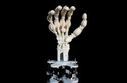 FIGURE 1. Researchers have 3D printed a robotic hand&mdash;complete with bones, ligaments, and tendons&mdash;out of varying rigid and elastic polymers, all in a single and more efficient process, using a unique laser scanning technique.