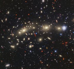 FIGURE 3. This panchromatic view of galaxy cluster MACS0416 was created by combining infrared observations from Webb with visible-light data from Hubble. FIGURE 3. This panchromatic view of galaxy cluster MACS0416 was created by combining infrared observations from Webb with visible-light data from Hubble.