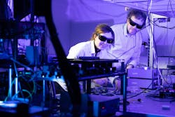 FIGURE 1. Anahita Khodadad Kashi and Michael Kues at the Institute of Photonics performing the quantum experiment. FIGURE 1. Anahita Khodadad Kashi and Michael Kues at the Institute of Photonics performing the quantum experiment.