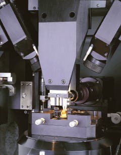 Microwelding workstation uses pulsed 50-W Nd:YAG laser with multibeam fiberoptic-beam-delivery system to attach fiber to a 980-nm pump laser diode 'butterfly' package. Fiber is held in place by upper tweezers.
