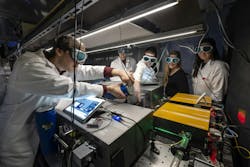 Bernhardt’s team in the lab with part of the spectrometer’s setup. Bernhardt’s team in the lab with part of the spectrometer’s setup.
