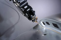 FIGURE 1. Adaptive laser optics follow the 3D contour. Its camera sends live images to a neural network, which detects defects from a laser brazing process in real time. FIGURE 1. Adaptive laser optics follow the 3D contour. Its camera sends live images to a neural network, which detects defects from a laser brazing process in real time.