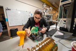 Kaushalya Jhuria, a postdoctoral scholar in Berkeley Lab’s Accelerator Technology & Applied Physics Division, testing electronics from the experimental setup used to make qubits in silicon. Kaushalya Jhuria, a postdoctoral scholar in Berkeley Lab’s Accelerator Technology & Applied Physics Division, testing electronics from the experimental setup used to make qubits in silicon.