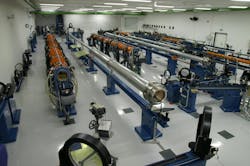 FIGURE 5. Overview photograph of the PALS laser system used in boron nitride target experiments; iodine photodissociation laser amplifiers are the orange tubes, while the silver-gray tubes are spatial filters. FIGURE 5. Overview photograph of the PALS laser system used in boron nitride target experiments; iodine photodissociation laser amplifiers are the orange tubes, while the silver-gray tubes are spatial filters.