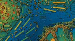 LiDAR mapping: Aerial drone photos processed into GIS 3D illustration of urban area, highlighting roads, junctions, and dense infrastructure.