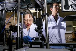 NTU Singapore research associate Liliana Tjahjana (left) loading a sample made of perovskites and gold onto a visible light detector, with Nanyang assistant professor Liang Jie Wong, also from the University, monitoring the setup. NTU Singapore research associate Liliana Tjahjana (left) loading a sample made of perovskites and gold onto a visible light detector, with Nanyang assistant professor Liang Jie Wong, also from the University, monitoring the setup.
