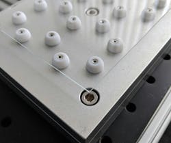 FIGURE 3. Custom spherical pedestal design for thin, delicate materials to minimize backside contamination. FIGURE 3. Custom spherical pedestal design for thin, delicate materials to minimize backside contamination.