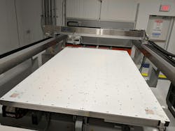 FIGURE 4. A large-scale PTFE G400 laser vacuum chuck (>1.2 × 2.3 m) for large sheets of thin glass. FIGURE 4. A large-scale PTFE G400 laser vacuum chuck (>1.2 × 2.3 m) for large sheets of thin glass.