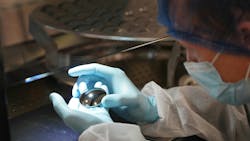 Lens inspection in LightPath Technologies' Orlando facility. Lens inspection in LightPath Technologies' Orlando facility.