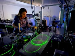 Rana Asgari Sabet performs laser writing experiments in silicon. Rana Asgari Sabet performs laser writing experiments in silicon.