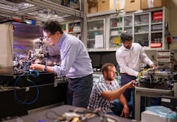Sandia National Laboratories’ Scientist Jongmin Lee (left) prepares a rubidium cold-atom cell for an atom interferometry experiment while Scientists Ashok Kodigala (right) and Michael Gehl initialize the controls for a packaged single-sideband modulator chip. Sandia National Laboratories’ Scientist Jongmin Lee (left) prepares a rubidium cold-atom cell for an atom interferometry experiment while Scientists Ashok Kodigala (right) and Michael Gehl initialize the controls for a packaged single-sideband modulator chip.