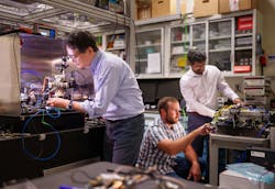 Sandia National Laboratories’ Scientist Jongmin Lee (left) prepares a rubidium cold-atom cell for an atom interferometry experiment while Scientists Ashok Kodigala (right) and Michael Gehl initialize the controls for a packaged single-sideband modulator chip. Sandia National Laboratories’ Scientist Jongmin Lee (left) prepares a rubidium cold-atom cell for an atom interferometry experiment while Scientists Ashok Kodigala (right) and Michael Gehl initialize the controls for a packaged single-sideband modulator chip.