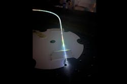 Microstructure fiber post-process and illuminated with white light. Microstructure fiber post-process and illuminated with white light.