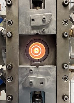 Inside the optical fiber furnace, the glass is heated and formed into a neck down. Inside the optical fiber furnace, the glass is heated and formed into a neck down.