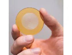 When manufacturing a 256-level diffraction harmonic lens, photoresist with a thickness of 7 μm is applied to the surface of silica glass. Using laser light, a 256-level relief is drawn on the resist. Production of a single lens takes about half an hour. Compensation of image distortions is done by the digital processing of images using extremely precise neuron networks.