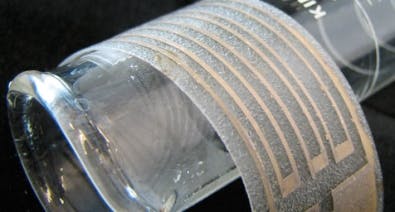 Non-particle-based silver ink is airbrushed onto a plastic film to make a flexible silver electrode.