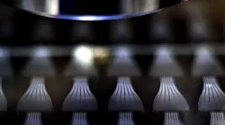Wafer-scale fabrication of fiber fan-out.