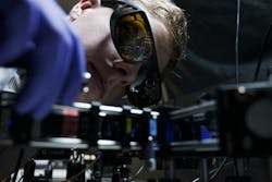 Ph.D. student Leevi Kallioniemi from NTU Singapore’s School of Physical & Mathematical Sciences with a blue laser setup for generating entangled photon pairs. Ph.D. student Leevi Kallioniemi from NTU Singapore’s School of Physical & Mathematical Sciences with a blue laser setup for generating entangled photon pairs.