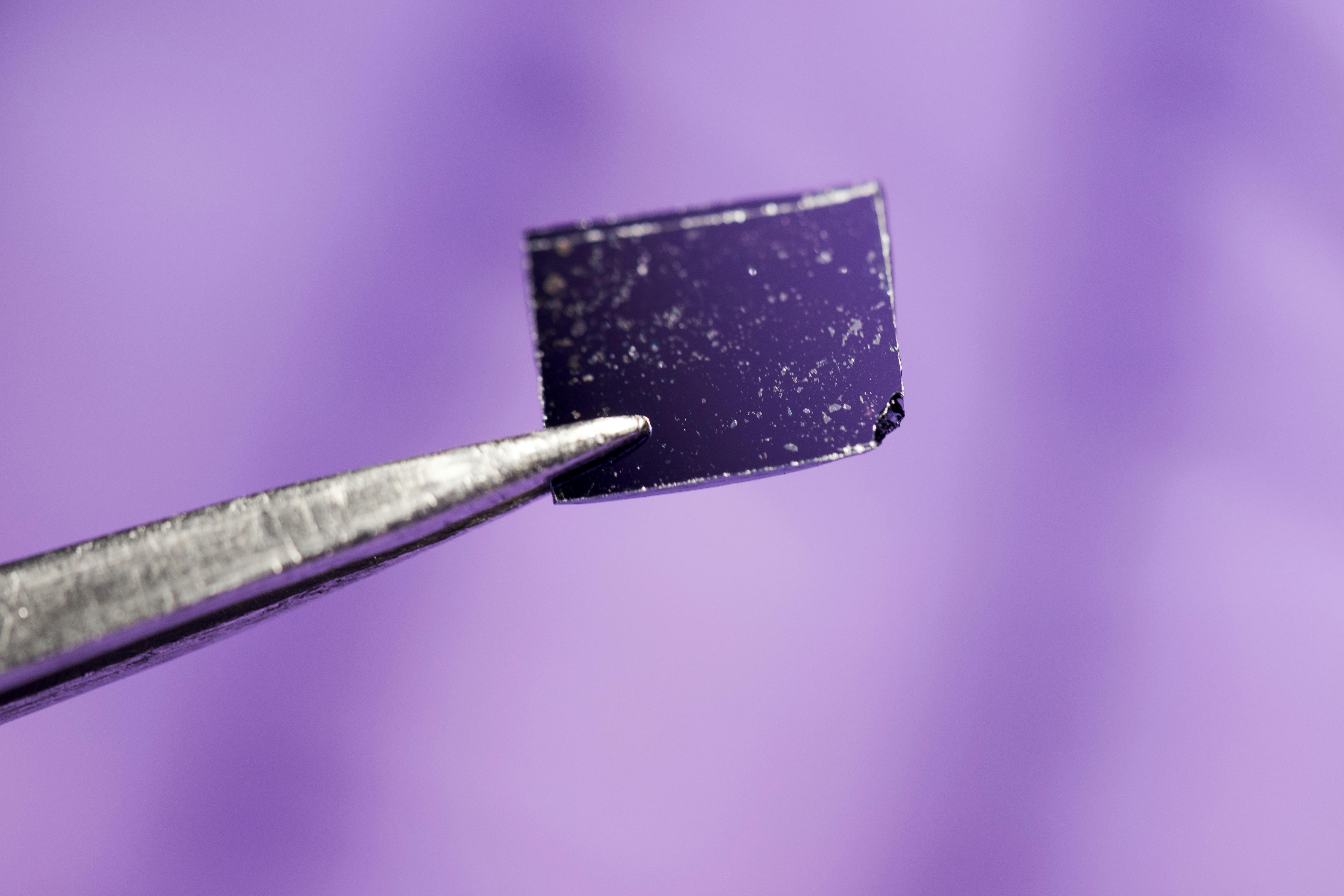 Flakes of niobium oxide dichloride on a sample holder.