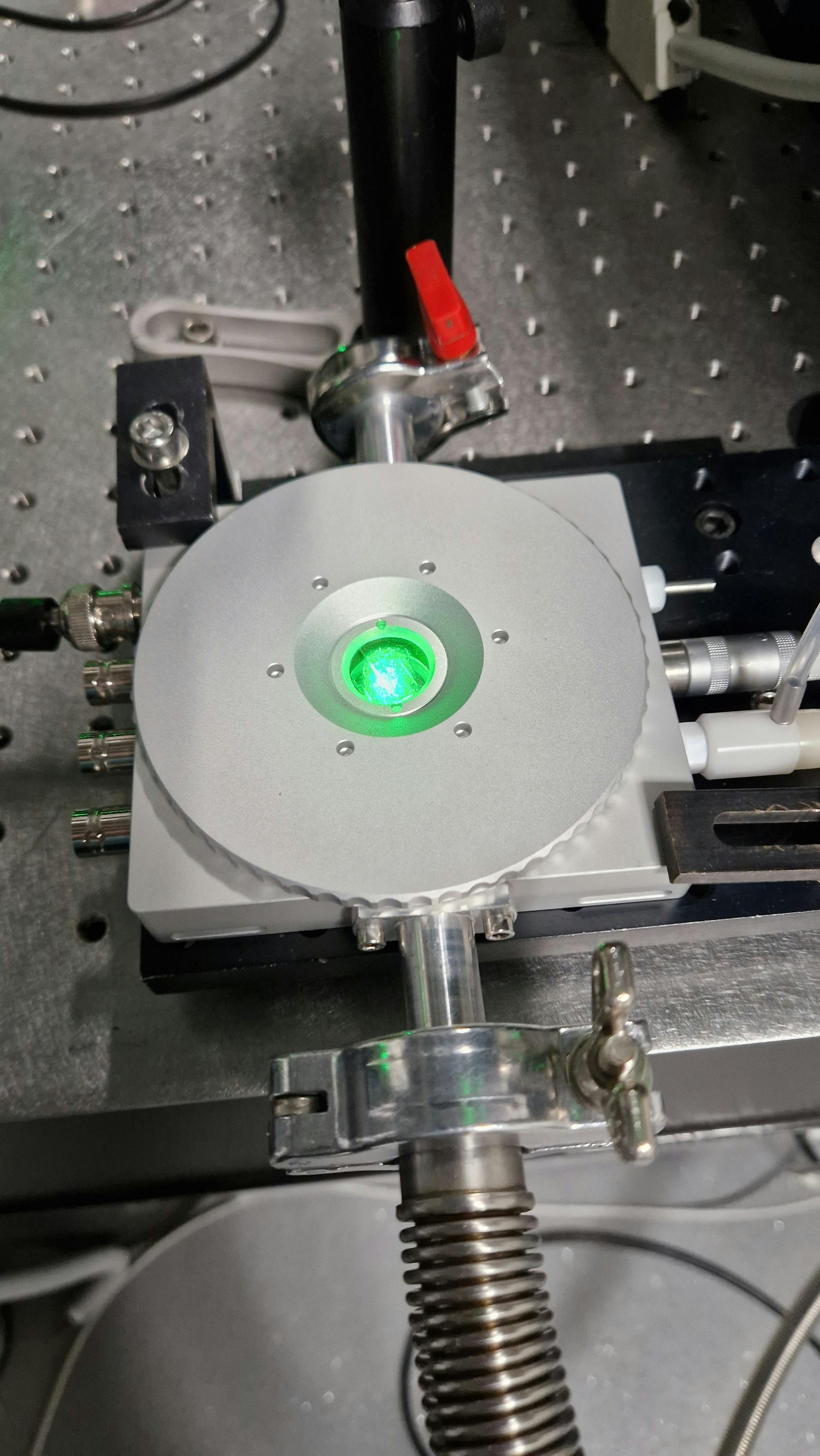 Close-up of the solar cell under cryogenic conditions being powered by a laser.