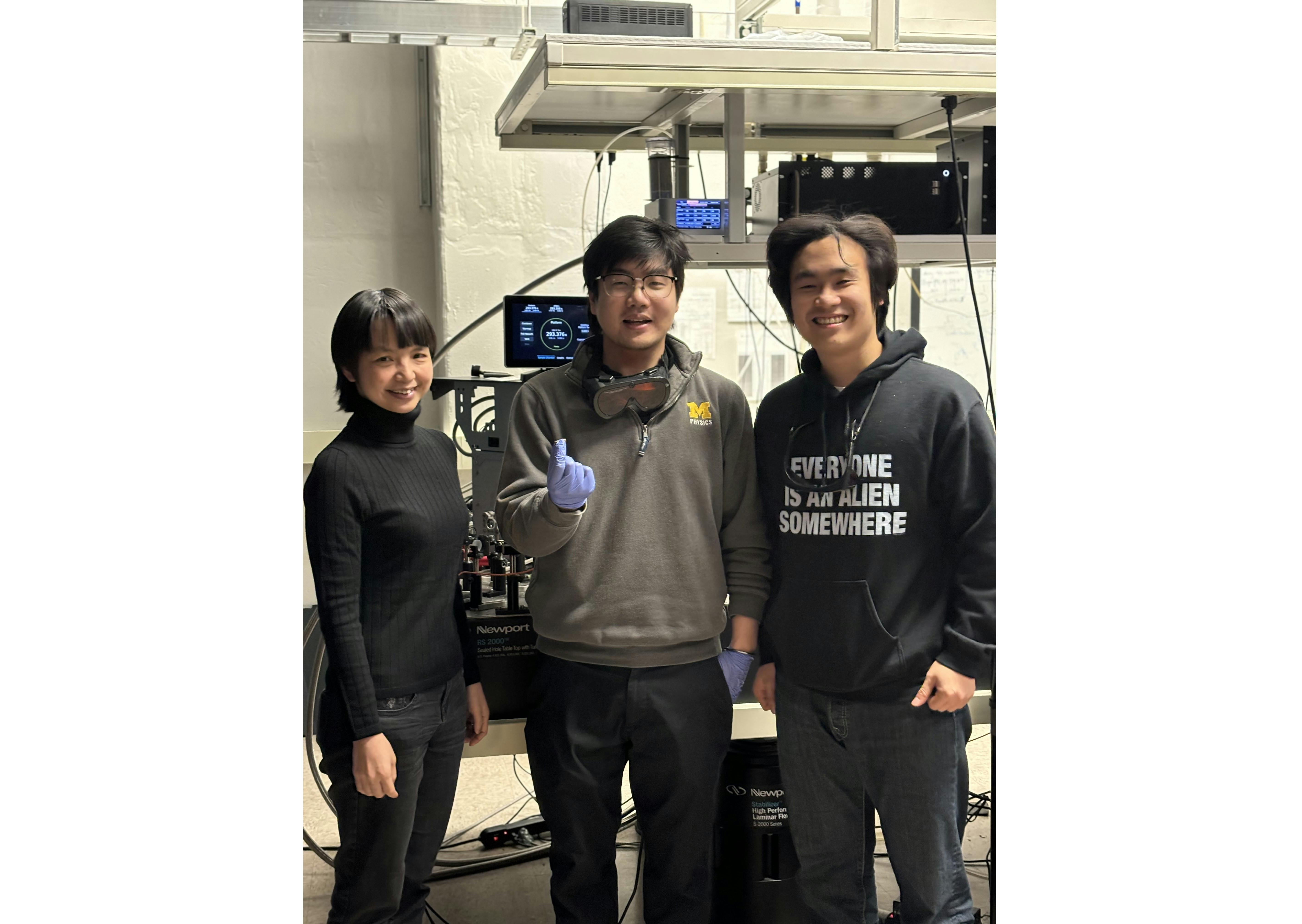 Professor Hui Deng (left), Lingxiao Zhou, and Chenxi Liu in the lab.