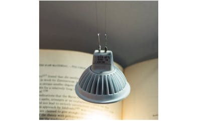 This light bulb is powered and held in place by two strands of carbon nanotube fibers that look and feel like textile thread. The nanotube fibers conduct heat and electricity as well as metal wires but are stronger and more flexible.