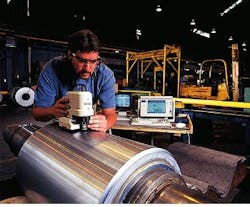 FIGURE 1. White-light vertical-scanning, phase-shifting interferometer can measure surfaces as rough as 20 µm rms with vertical resolutions of 3 Å rms. FIGURE 1. White-light vertical-scanning, phase-shifting interferometer can measure surfaces as rough as 20 µm rms with vertical resolutions of 3 Å rms.