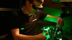FIGURE 1. A Chromacity engineer aligns an ultrafast fiber laser with second-harmonic generation. FIGURE 1. A Chromacity engineer aligns an ultrafast fiber laser with second-harmonic generation.