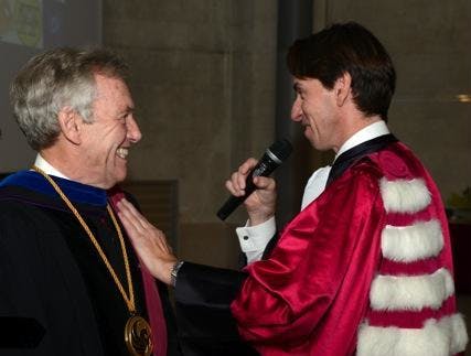 President Dean Lewis of the University of Bordeaux vests Professor Martin Richardson of the University of Central Florida with the insignia of a 'Docteur Honoris Causa' of the University of Bordeaux.