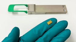 On the glove: A SCINTIL chip—a bank of 16 lasers monolithically integrated on a silicon photonic circuit and wavelength multiplexed. On the glove: A SCINTIL chip—a bank of 16 lasers monolithically integrated on a silicon photonic circuit and wavelength multiplexed.