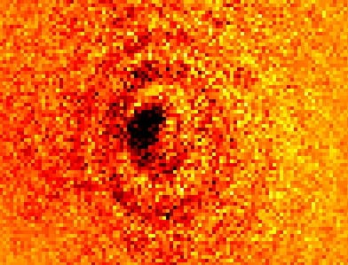 A shadow is cast by a single ytterbium atom placed in a 4.8 &mu;m focused spot of light at 369.5 nm.