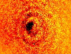 A shadow is cast by a single ytterbium atom placed in a 4.8 μm focused spot of light at 369.5 nm. A shadow is cast by a single ytterbium atom placed in a 4.8 μm focused spot of light at 369.5 nm.