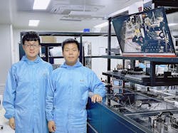 The team’s diamond Raman vortex laser experimental optical platform with Zhenxu Bai (left) and Hui Chen (right) of the paper. A physical image of the device is also shown on the right-hand monitor in the background. The team’s diamond Raman vortex laser experimental optical platform with Zhenxu Bai (left) and Hui Chen (right) of the paper. A physical image of the device is also shown on the right-hand monitor in the background.