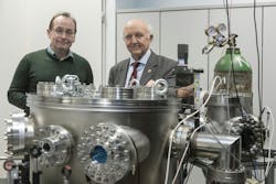 FIGURE 1. Tamás Biró and Norbert Kroó in the Hidra laser lab at WIGNER CRP; the vacuum chamber in the foreground is used for the target. FIGURE 1. Tamás Biró and Norbert Kroó in the Hidra laser lab at WIGNER CRP; the vacuum chamber in the foreground is used for the target.