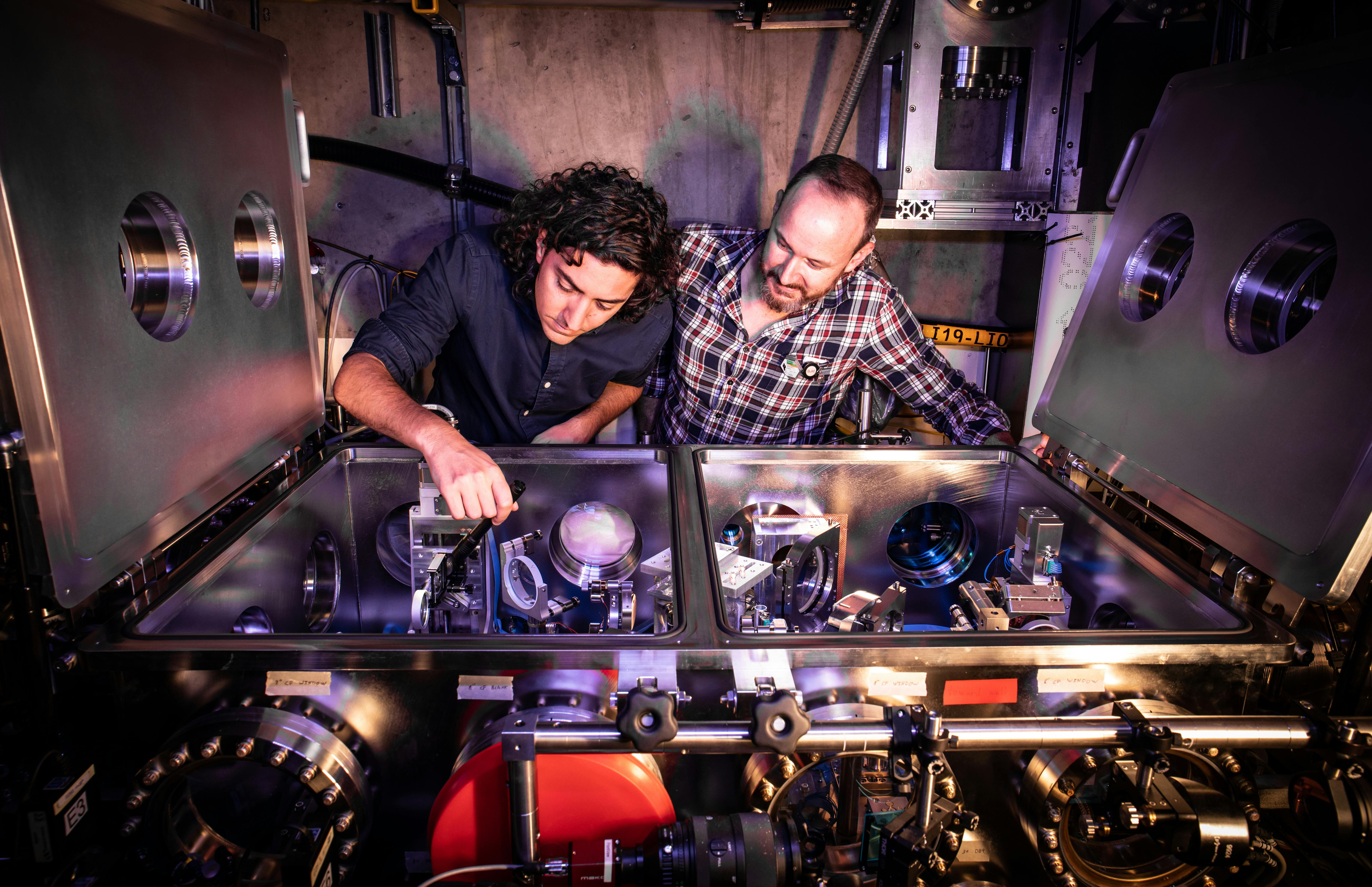 Claudio Emma and Brendan O&rsquo;Shea examine experimental apparatus at FACET-II in 2022. Credit: Jacqueline Ramseyer Orrell/SLAC National Accelerator Laboratory