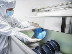 A researcher holds a highly reflective mirror for laser applications; the technology is being optimized for laser fusion. A researcher holds a highly reflective mirror for laser applications; the technology is being optimized for laser fusion.