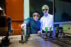 Adrian Sabau and Jian Chen work with a laser to prepare the surface of carbon fiber composites and aluminum for bonding. Adrian Sabau and Jian Chen work with a laser to prepare the surface of carbon fiber composites and aluminum for bonding.