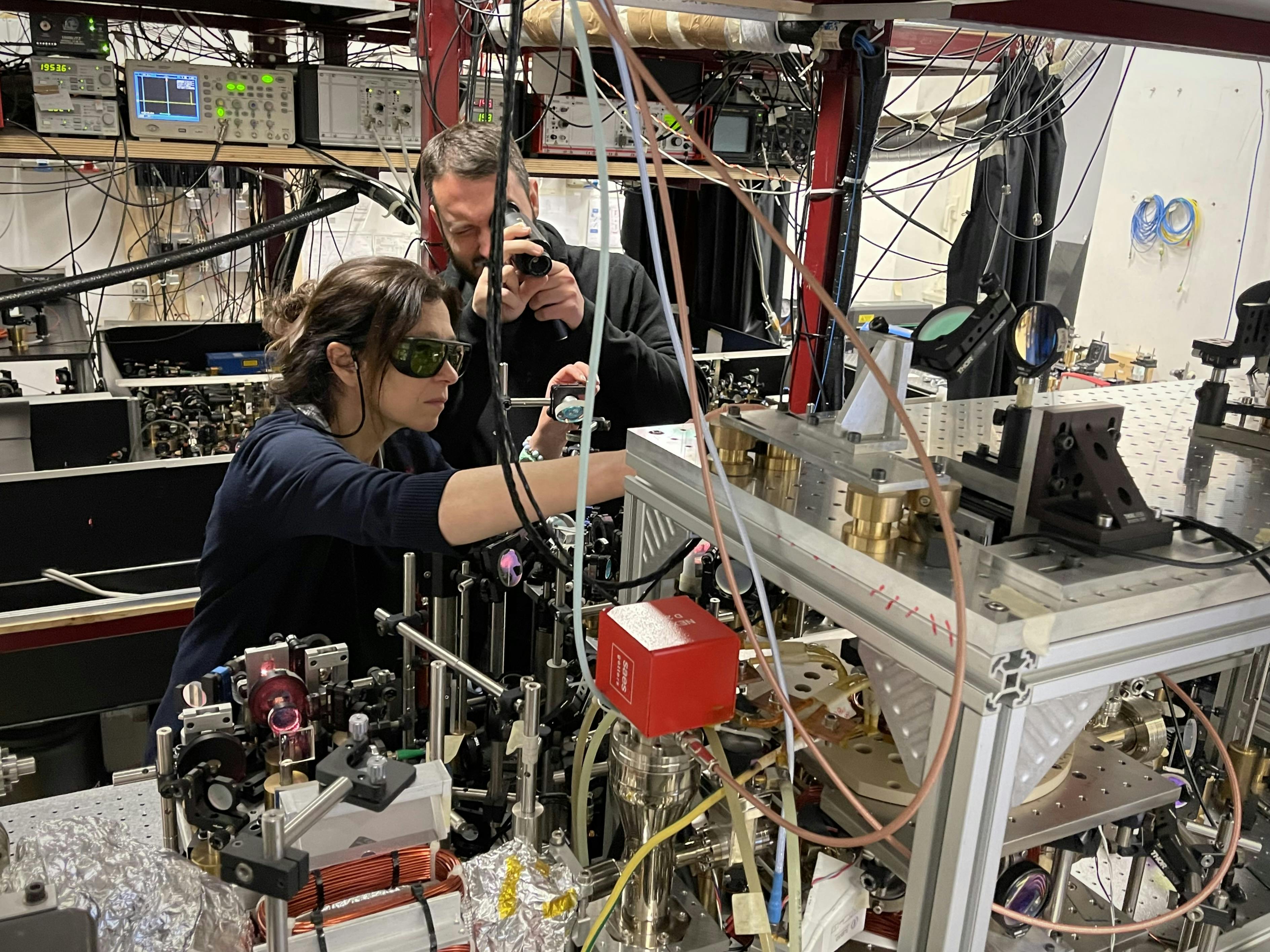Alessia Burchianti and Luca Cavicchioli in the lab with their setup. Credit: CNR-INO Quantum Mixtures Lab