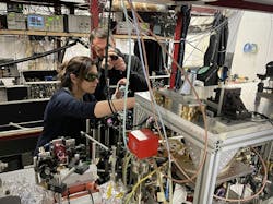 Alessia Burchianti and Luca Cavicchioli in the lab with their setup. Credit: CNR-INO Quantum Mixtures Lab Alessia Burchianti and Luca Cavicchioli in the lab with their setup. Credit: CNR-INO Quantum Mixtures Lab