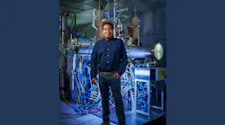 Sandia Physicist Raktim Sarma in the lab where they’re exploring chilling chips via light. Credit: Craig Fritz/Sandia