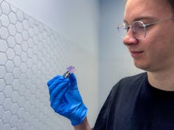 Daniel Tibben holding the team’s experimental device. Daniel Tibben holding the team’s experimental device.