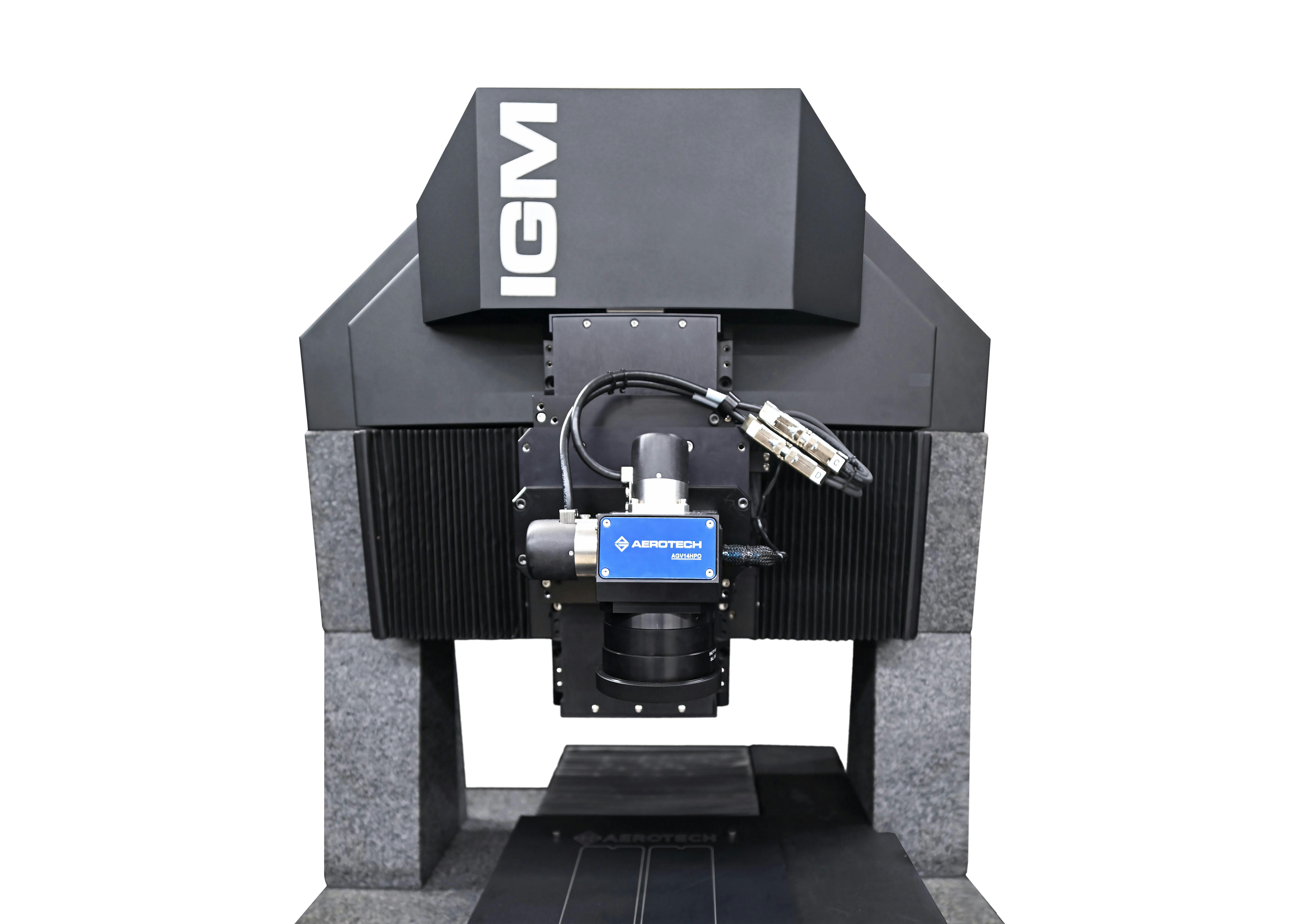 FIGURE 1. Example of a high-dynamic motion system that consists of a split-axis linear motion system with stages directly integrated on granite and a high-dynamic 2-axis galvanometer scanner head.