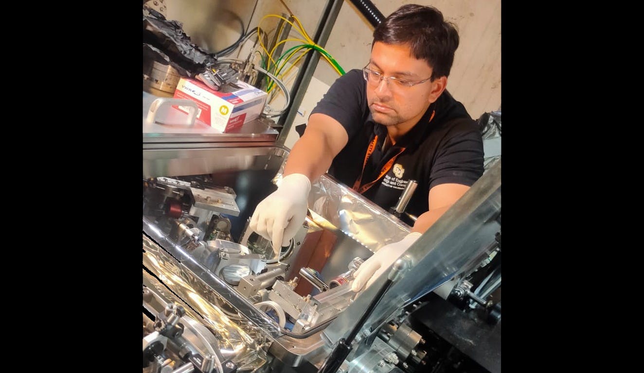 Aakash Sahai in the laser lab with their setup at the University of Colorado Denver. Credit: University of Colorado Denver