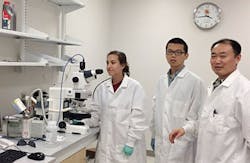 Professor Xiaoming “Shawn” He (right) with two of his students, Samantha Stewart (left) and Yuntian Zhang (center), next to the Linkam cryomicroscopy system. Professor Xiaoming “Shawn” He (right) with two of his students, Samantha Stewart (left) and Yuntian Zhang (center), next to the Linkam cryomicroscopy system.