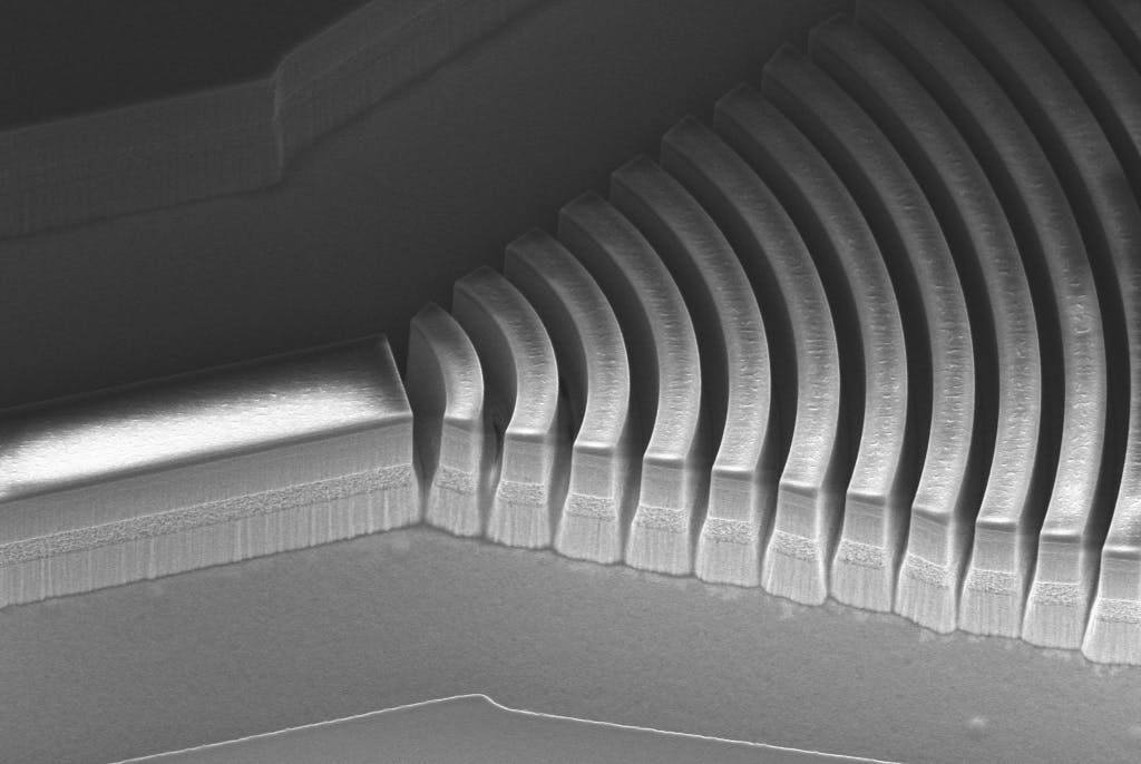 SEM image of a curved double-chirped mirror before gold electroplating (for heat removal). Credit: Qing Hu&rsquo;s group/MIT