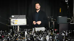Professor Andreas Tittl in front of his lab’s optical table. Credit: Stephan Höck