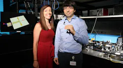 FIGURE 1. Christina Beanea-Chelmus, head of EPFL’s Laboratory of Hybrid Photonics, with Yazan Lampert, who holds the team’s lithium niobate chip that generates and detects THz by converting them to and from ultrafast optical signals.