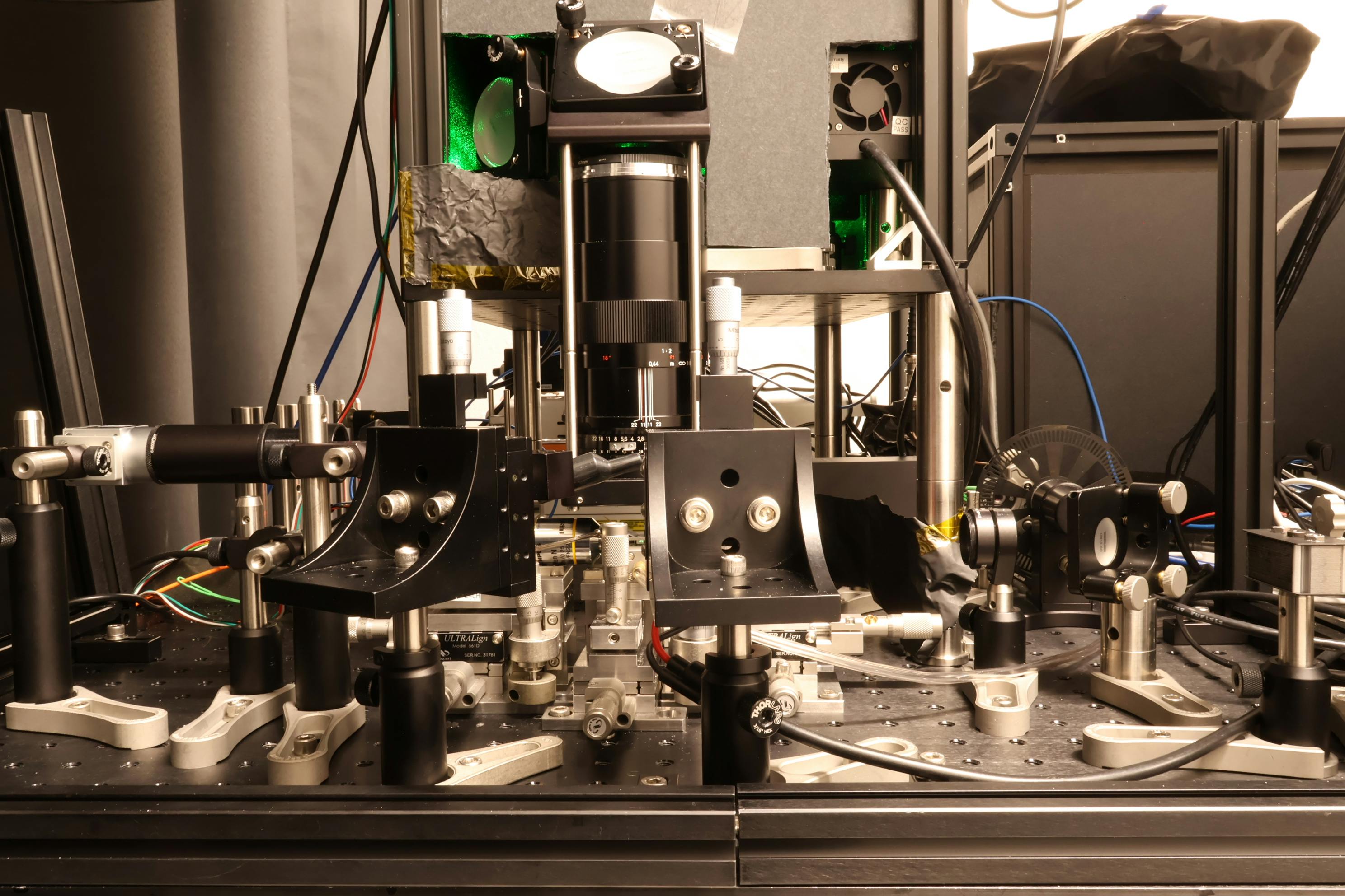Side view of the group&rsquo;s experimental setup to operate programmable nonlinear photonic waveguides. Credit: NTT Research