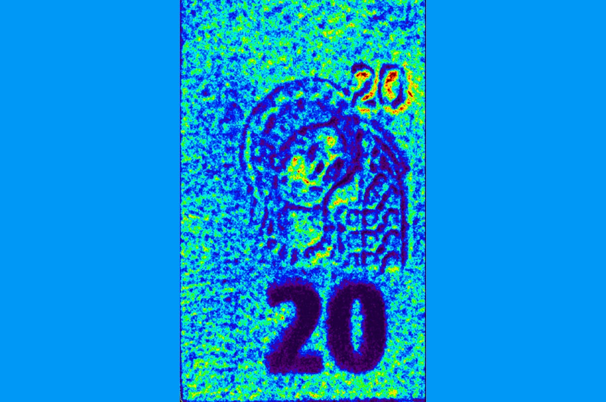False color picture of the watermark of a &euro;20 bank note, showing the amplitude of the transmitted terahertz electrical field signal with varying optical parameters of the material; the highest amplitude is shown in red, and the lowest in blue. The image was recorded by Menlo Systems&rsquo; TERA K15 THz-TDS system with TERA Image imaging extension unit and ImageLab processing software.