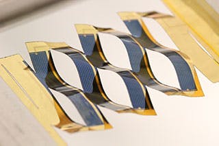 Cuts in a flexible backing for solar cells allow a flat solar panel to separate into many small cells that can track the sun across the sky. Tracking provides a 20% to 40% improvement in the amount of energy captured by the cells.